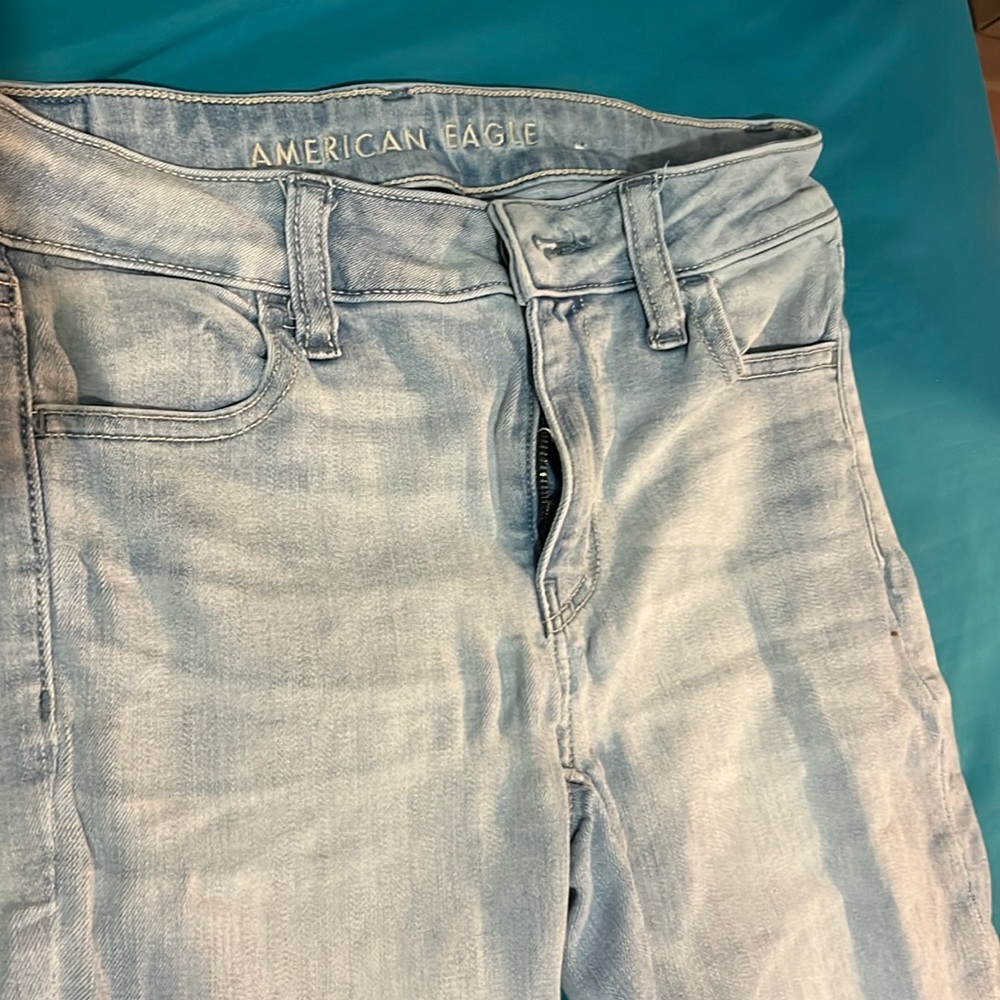 A pair of American eagle next level stretch jeans